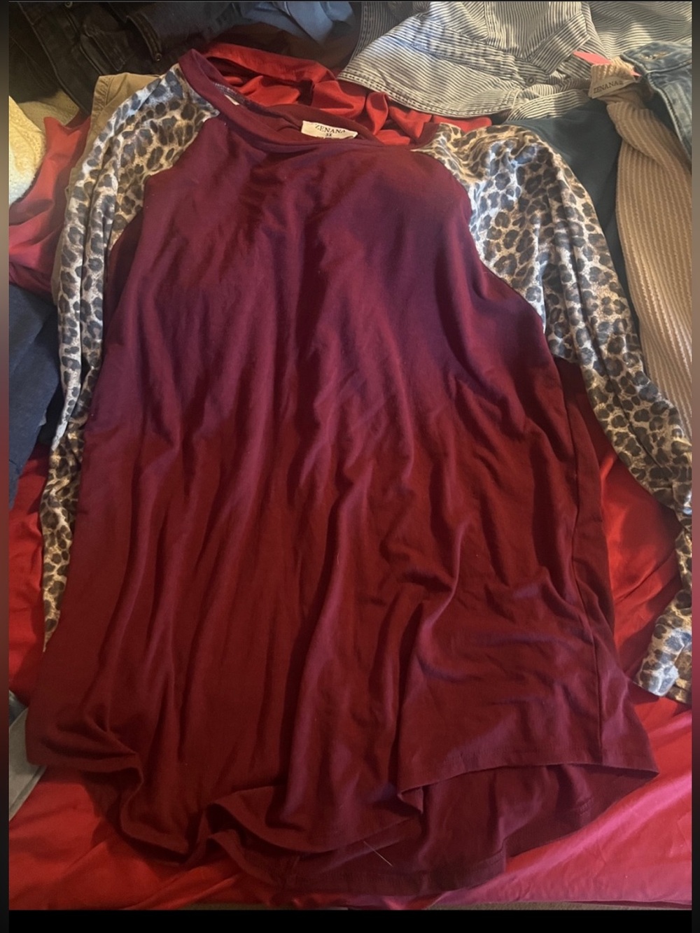 Zenana baseball style shirt with leopard 3/4 sleeves.